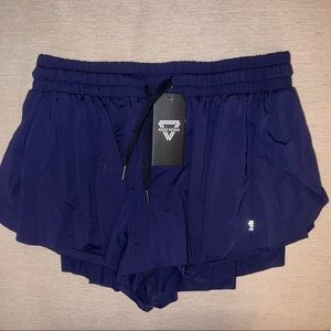 NWT Keiki Kona shorts in navy blue w/ pocket. Super soft and flowy